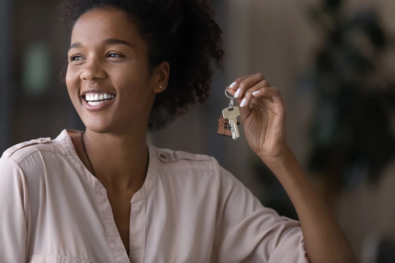 A woman getting keys to her first home