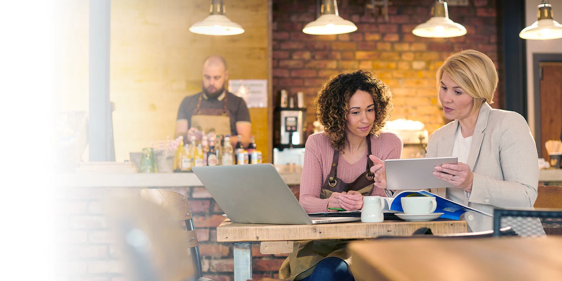 A business owner talking to a small business banker about a loan